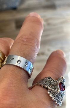 "Hammered, shaped, and stamped by hand from 1/4 inch wide metal , this ring features the word \"dream\"... This ring is adjustable between sizes 7 and 9. Have another word in mind? Reach out with a \"customize\" request.  We'll see what we can do!" Hand Stamped, Band Rings, 4 Inch, Jewelry Rings, Handmade Items, Size 7, Stamp, Band, Ring