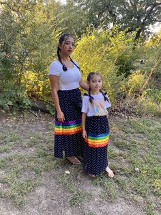 These native inspired ribbon skirts are handmade by me with much care, to the empowerment of Indigenous people everywhere. Perfect for any festival, ceremony, traditional celebration, or special event.  Your beauty is empowering, and the respect is over the top. Let your cup overflow when you wear these handcrafted pieces. My prayer is that you feel the love and recognition you deserve.  Colors include: Fabric: black with white design Ribbons: rainbow pattern of purple, blue, green, yellow, orange and red  **Please choose a size from the size chart in the pictures. Let me know if you need any special adjustments to the size options listed or would like different color of ribbons. ** Each skirt will come with a couple strips of matching fabric to wear in your hair or attach to other regalia Rainbow Ribbons, Ribbon Skirt, My Prayer, Ribbon Skirts, Ribbon Dress, Womens Skirts, Indigenous People, Fabric Black, Rainbow Pattern