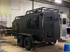 an armored vehicle is parked in a warehouse