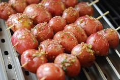 there are many tomatoes on the grill with some seasoning sprinkled on them