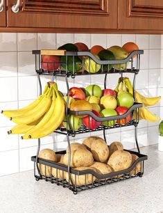 three tiered fruit and vegetable rack with potatoes, pears, apples, bananas