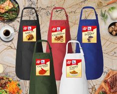 three aprons with different types of food on them and the words campbell's