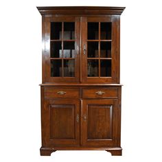 an old wooden cabinet with glass doors on the top and bottom shelf, against a white background