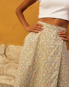 Vintage floral midi skirt in cream and multicolour print.. Waist tie. A line skirt. UK 8 / EU 36 Measurements - 26"/ 71cm waist - 36" / 92cm hips - 25" / 100cm length. Condition - Excellent Material - Cotton. Model is a UK 6/8 and is 5'7" tall Beige Floral Print Skirt For Day Out, Retro Beige Skirt For Spring, Multicolor Mini Wrap Skirt For Spring, Floral Print Midi Wrap Skirt For Spring, Spring Floral Print Midi Wrap Skirt, Beige Floral Print Midi Skirt, Multicolor Floral Print Wrap Skirt For Summer, Spring Full Wrap Skirt With Gathered Details, Multicolor Floral Print Wrap Skirt For Spring