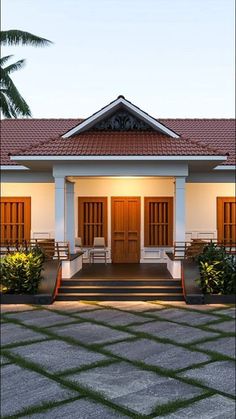 a house with two doors and steps leading up to it