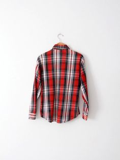 A classic vintage JC Penney Big Mac plaid work shirt. The flannel cotton shirt features a bold red, black, and white print. Bias cut patch pockets detail the chest. It buttons closed. • JC Penney Big Mac shirt• 100% Cotton• plaid flannel• pockets on chest• button down• button cuffsCONDITIONIn good condition with wear consistent with age and use. MARKED SIZE:  MMEASUREMENTSBust:          22.5" (45)     ...       57.2 cm (114.3)Length:      27.5"            ...        69.9 cmSleeves:    32.5" Vintage Plaid Workwear Shirt, Red Vintage Cotton Flannel Shirt, Vintage Plaid Cotton Flannel Shirt, Vintage Flannel Button-up Shirt With Pockets, Vintage Red Button-up Flannel Shirt, Vintage Flannel, Big Mac, Plaid Flannel Shirt, Plaid Flannel