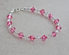 Pink Crystal Bracelets With Faceted Beads, Pink Crystal Bracelet Gift, Pink Beaded Sterling Silver Bracelets, Pink Sterling Silver Crystal Bracelet As A Gift, Pink Hypoallergenic Sterling Silver Bracelets, Hypoallergenic Pink Sterling Silver Bracelets, Handmade Pink Crystal Bracelet For Wedding, Pink Hypoallergenic Sterling Silver Bracelet, Pink Adjustable Crystal Bracelet With Rhinestones