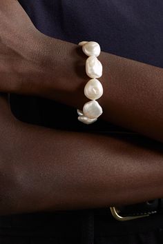 Mateo's bracelet is strung with an array of baroque pearls - each one has its own unique markings and organic shape, making this style completely one-of-a-kind. It's handcrafted from 14-karat gold and has an adjustable chain that ensures it'll fit comfortably on any size wrist. Elegant Single Strand Baroque Pearl Bracelet, Single Strand Baroque Pearl Bracelet As Gift, Luxury Baroque Pearl Jewelry With Oyster Bracelet, White Baroque Pearl Bracelets For Formal Occasions, Elegant Hand-strung Pearl White Bracelet, Formal Baroque Pearl Drop Bracelet, Elegant Formal Baroque Pearl Bracelets, Formal White Baroque Pearl Bracelets, Elegant Single Strand Baroque Pearl Bracelets