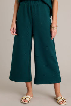 Say hello to your new go-to pants! These Tell Me Forest Green Cropped Textured Pants are not only stylish, but also comfortable and versatile. Perfect for making a statement, you'll love the unique texture and playful color (not to mention the flattering cropped length). Get ready to turn heads and make a statement! These pants feature a high waisted design, an elastic waistband, functional hip pockets, a textured crisscross design, and a wide leg. Green High-waisted Wide Leg Pants For Fall, Green Wide Leg Pants For Loungewear In Fall, Green Wide Leg Pants For Fall Loungewear, Green Wide Leg Pants For Loungewear, Green Fall Loungewear Bottoms, Green Wide Leg Ankle-length Pants For Loungewear, Green Ankle-length Wide Leg Pants For Loungewear, Green Ankle-length Loungewear Pants, Green Ankle-length Lounge Pants