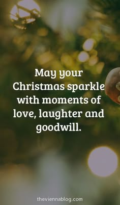 a christmas ornament hanging from a tree with the words, may your christmas sparkle with moments of love, laughter and good will