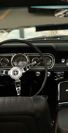 the interior of an old fashioned car with dashboard and gauges on it's dash board