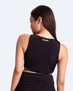 We dare you to blend into the crowd with the Sexy Front-Tie Support Top. Jokes! There’s no blending in with this top, but we’ve got a feeling blending in will be your last priority. Stand out and look good while doing it with this statement piece in your lineup. Black Tops With Built-in Bra For Club, Edgy Tops With Built-in Bra For Night Out, Black Athleisure Tops With Built-in Bra, Black Athleisure Crop Top, Sporty Sleeveless Crop Top For Night Out, Black Top With Built-in Bra For Club, Black Club Tops With Built-in Bra, Edgy Sleeveless Workout Tops, Edgy Black Tank Top For Workout