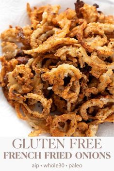 a white plate topped with fried onion rings