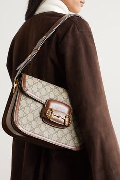 Brown Horsebit 1955 leather-trimmed printed coated-canvas shoulder bag | GUCCI | NET-A-PORTER Best Designer Bags, It Bag, Gucci Horsebit, Sienna Miller, Bags Aesthetic, Print Coat, Samar, Designer Shoulder Bags, Canvas Shoulder Bag