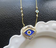 This is a listing for a sterling silver 14k gold plated turquoise blue evil eye necklace. Below the marquise shaped enamel eye are three round bezeled zircon gemstones. The chain necklace is also adorned with round bezeled zircons. The chain length is 16 inches with a 2 inch extension (total chain length is 18 inches long). Very pretty talisman necklace!. Also listed is a sterling silver 14k gold plated bright navy blue evil eye necklace. The marquise shaped enamel eye is framed in round bezeled Blue Evil Eye Necklace, Gold Evil Eye Necklace, Necklace Evil Eye, Evil Eye Necklace Gold, Protection Jewelry, Talisman Necklace, Protection Necklace, Blue Evil Eye, Necklace Blue