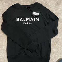 I Love This Thing! Excellent Condition As It’s New. I May Just Keep It Black Luxury Sweatshirt With Letter Print, Luxury Crew Neck Sweatshirt With Letter Print, Luxury Logo Print Tops For Fall, Luxury Long Sleeve Tops With Logo Detail, Designer Black Long Sleeve Sweatshirt, Designer Black Sweatshirt With Logo Print, Balmain Sweatshirt, Balmain Sweater, Adidas Sweatshirt Women