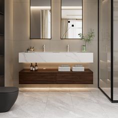 a modern bathroom with two sinks and mirrors