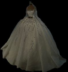 a white ball gown with sequins on it