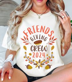 This shirt features a delightful and cozy "Friendsgiving Crew 2024" design, perfect for a festive holiday. This T-shirt design is ideal for anyone looking to celebrate Friendsgiving with their closest friends, offering a stylish and fun way to commemorate the occasion. The combination of cozy imagery and warm colors makes it an appealing choice for anyone wanting to embrace the spirit of the season with their "Friendsgiving Crew." *PRODUCT DETAILS -Comfort Colors 1717 Brand -6.1 oz. -Preshrunk, soft-washed, garment-dyed fabric -Twill taped shoulder-to-shoulder -Sleeves and bottom hem expertly double-needle stitched - Unisex Sizing - Relax fit - Pre-shrunk -Tear away label * SIZING AND COLORS - Please refer to color charts and sizing in the images * FABRIC - 100% ringspun US cotton * CARE I Friendsgiving Shirt Ideas Funny, Cozy Friendsgiving, Friends Themed Thanksgiving Shirts, Friends Tv Show Thanksgiving Shirts, Friends Thanksgiving Shirt, Friend Thanksgiving, Womens Thanlsgiving Shirt, Friendsgiving Shirt, Thanksgiving Friends