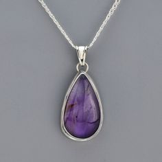 This teardrop-shaped amethyst pendant is your new favorite piece. With its purple hues set in sterling silver, it's perfect for adding a touch of elegance to any outfit. Pair it with a simple chain for a sophisticated look or layer it with other necklaces for a trendy, boho vibe. Pendant only, the chain is sold separately. Gemstone - Genuine Amethyst 950 Sterling Silver Approx. 2.4" L x 1.1" W Handmade in Taxco, Mexico Teardrop Amethyst Necklace For Formal Occasions, Formal Teardrop Amethyst Necklace, Purple Teardrop Necklace For Formal Occasions, Purple Teardrop Necklace For Formal Events, Silver Amethyst Teardrop Jewelry, Silver Teardrop Amethyst Jewelry, Purple Sterling Silver Necklace With Polished Finish, Silver Amethyst Pear-shaped Jewelry, Silver Pear-shaped Amethyst Jewelry