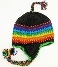 Rainbow Woolen Hat in Black with Rainbow Tassels | Accessories | Multicoloured | Vacation, Fall, Handmade, Skiing, Pride Adjustable Black Hand Knitted Beanie, Multicolor Wool Hat For Winter, Warm Multicolor Wool Hats, Adjustable Multicolor Hat With Ear Flaps, Adjustable Multicolor Winter Hat, Black Winter Hat, Arm Crocheting, Ski Trips, Rainbow Hats