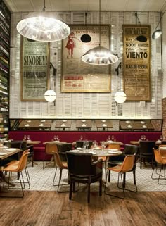 an empty restaurant with tables and chairs in front of the menus on the wall