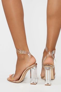 Don't worry about having to run out before midnight - these ones have straps. The Glass Slipper features clear straps, a chunky, 4-inch Lucite heel and patent leather detailing. Now, go find your Prince. Available in Transparent, Pink, Black, Rose Gold and Silver Clear Straps Lucite Heel Patent Leather 4 Inch Heel Imported | The Glass Slipper Heel Shoes in Rose Gold size 8 by Fashion Nova Woman Heels, Trending Heels, Rose Gold Fashion, Lucite Heels, Rose Gold And Silver, Leather Detailing, Wedding Plan, Before Midnight, Mesh Shoes