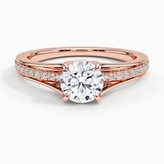 a rose gold engagement ring with diamonds on the side