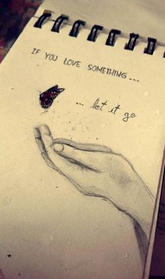 a drawing of a hand holding a butterfly on top of a notepad that says if you love something let it go