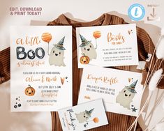 three halloween baby shower cards on top of a brown shirt with orange and white balloons