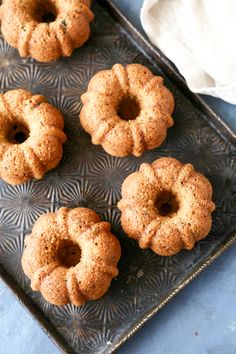 four bundt cakes on a metal tray