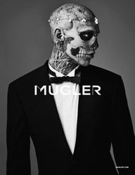 a man in a tuxedo is wearing a skull mask and bow tie with the word mugler written on it