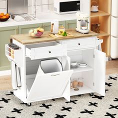 a white kitchen cart with dishes and utensils on it in front of the counter