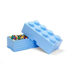 a blue lego storage box filled with lots of colorful legos on top of it