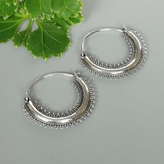 IMPORTANT **Please go through all the pictures i have posted for a listing with a ruler, on a model, on my hand, to get an exact idea of the actual size of the item. Tibetan style sterling silver chunky hoops. Dimensions: 22 x 25 mm Price is for ONE PAIR. These earrings are made of 925 hypoallergenic sterling silver. Most of my pieces come with a 925 stamp. Can be packaged in a gift box. I can include a personal message from you if needed You are welcome to contact me at... bhavnakwintra1956@gma Bohemian Sterling Silver Hoop Earrings For Festivals, Handmade Bohemian Sterling Silver Hoop Earrings, Silver Bohemian Hoop Earrings With Oxidized Finish, Silver Bohemian Hoop Earrings For Festivals, Bohemian Small Hoop Sterling Silver Jewelry, Bohemian Sterling Silver Pierced Hoop Earrings, Bohemian Silver Small Hoop Jewelry, Handmade Sterling Silver Hoop Earrings For Festivals, Bohemian Sterling Silver Nickel-free Hoop Earrings