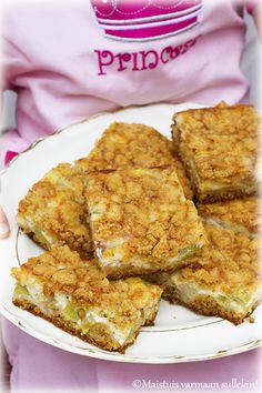 a person holding a white plate with food on it and the words princess written in pink