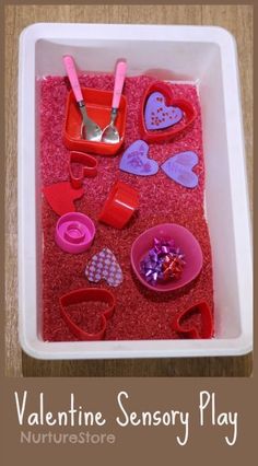 valentine's day activity for kids to play in the sand with spoons and hearts