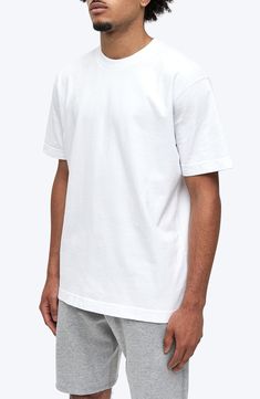 Exposed seams and a roomy, oversized fit define a T-shirt that's crafted for comfort from soft, midweight cotton jersey. 28" length (size Medium) Crewneck Short sleeves Smooth flatlock seaming designed to eliminate rubbing and irritation 100% cotton Machine wash, tumble dry Imported White Cotton Crew T-shirt, Boxy Fit Organic Cotton T-shirt With Crew Neck, White Crew Neck T-shirt For Loungewear, Sporty Relaxed Fit Cotton Jersey T-shirt, Oversized Solid Color Sporty T-shirt, Oversized Solid Sporty T-shirt, Sporty Oversized T-shirt, Basic Boxy Fit T-shirt In Organic Cotton, Basic Boxy Fit Organic Cotton T-shirt