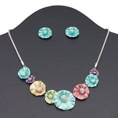 Add a dash of cheerfulness to your style with this silver-finished necklace and earring set. Brightly enameled flowers highlight this delightful set. Ready-to-wear jewelry is great for a gift or counter sales. Colors can include aqua blue, pink, green and more. Necklace And Earring Set, Silver Enamel, Everyday Jewelry, Aqua Blue, Lobster Claw, Gift Necklace, Earring Set, Brass, Chain