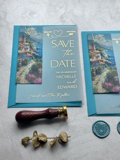 the wedding stationery is laid out on top of each other, including an envelope and wax stamp