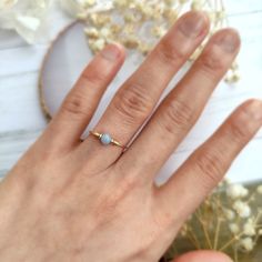 ✨ Blue Angelite Wire Ring, 14K Gold Filled, Rose Gold Filled, Sterling Silver, Tiny Gemstone Ring, Pinky RingSizing:• Gemstone Size: 4 mm• Ring Band: 0.8 mm • Handmade in your ring size with a natural gemstone bead. • Dainty & cute. The ring is slim and petite, yet durable to wear daily. • Gold-filled wire is known for its lasting quality. The ring will not tarnish or turn color. You can wear them every day or even in a shower.• Hypoallergenic. You won’t have to worry about allergies from metal 14k Gold Filled Gemstone Ring, Dainty 14k Gold Topaz Birthstone Ring, Adjustable 14k Gold Opal Birthstone Ring, Blue Opal Birthstone Ring In 14k Gold, Dainty Solitaire Topaz Ring, Tiny 14k Gold Birthstone Ring, Tiny Round 14k Gold Birthstone Ring, Dainty Round Birthstone Ring, Delicate Blue Birthstone Ring