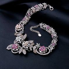 "**New** This is a beautiful Chunky 3D Flower and Leaves with Vibrant colors of Black,Purple, Pale Moss green, Pink and Ice Crystals,Raised Doubled Layered Clusters of Crystals.  This is a heavy necklace. This is the last Chunky 3D Flower and Leaves Crystal Necklace, I have in stock, the price has been lower.  This would be a great statement necklace. For a wedding, night out on the town or everyday outfit! Necklace is signed \"ZARA\".   The Prefect Gift for yourself  weight: Heavy Length: 16.5\" and has a 3\" extender chain  Last Necklace, there are some crystals missing and it is reflected in the price.  *SHIPPING* US ORDERS-ship through the USPS First Class, shipping takes 2-3 days with delivery confirmation.  INTERNATIONAL ORDERS are shipped through the USPS International First Class, Heavy Necklace, Evening Necklace, Flower And Leaves, Ice Crystals, Necklace Chunky, Necklace Statement, Swiss Blue Topaz, Wedding Night, Chunky Necklace