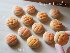 a person is pointing at some food on a table with words written in english and chinese