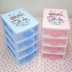 three plastic drawers with hello kitty stickers on them