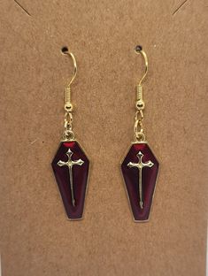 Handmade red coffin earrings. Gold-plated and hypoallergenic. Please allow 3-5 business days for shipping. Ships from Tennessee. Ruby Coffin Ring, Coffin Rings Jewelry, Coffin Jewelry Hanger, Vampire Earrings Gothic Jewelry, Coffin Earrings, Funky Jewelry, Tennessee, Favorite Jewelry, Jewelry Earrings Dangle