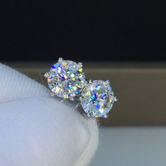 This is made-to-order item, it takes about 6-8 weeks to deliver your earrings after order is placed, thank you. If you are interested in earrings with other carat (0.5, 1, 1.5, 2, 2.5, 3 carats or larger) moissanite diamond, please send me a message to get a price quote. Lab created Moissanite diamond in six prong setting. 18K solid white gold stud earrings, also available in 18K rose gold or 18K yellow gold. Classic design, push back post. Moissanite diamond: -Color: D (colorless); -Clarity: VV Luxury Oval Bridal Earrings With Prong Setting, Anniversary Diamond Crystal Round Earrings, Anniversary Diamond Crystal Earrings, Elegant Lab Grown Diamond Cluster Earrings As Gift, Elegant Lab Grown Diamond Cluster Earrings For Gifts, Fine Jewelry Bridal Earrings With Vvs Clarity, Round Diamond Crystal Earrings For Anniversary, Dazzling Brilliant Cut Crystal Earrings For Anniversary, Diamond Crystal Earrings For Anniversary