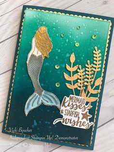 a card with a mermaid and sea plants on it