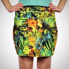 The warm yellow and green tones in this skirt capture its tranquil tropical feel. Wear Paradise anytime you’re feeling those vacation vibes! Fitted skirt shape 4-way stretch fabric Wicking anti-microbial undershorts; 6 to 7.5” inseam (based on size) Undershorts carry a patented anti-ride guarantee for running and walking Two 6X6” leg pockets Flat interior seams 12” zippered waistband pocket that can be worn front or back Please Note: Clearance items are not refundable or returnable or exchangeab Tropical Bottoms With Built-in Shorts, Green Stretch Lined Swim Skirt, Tropical Green Bottoms With Elastic Waistband, Green Mini Swim Skirt With Built-in Shorts, Tropical Multicolor Bottoms With Built-in Shorts, Green Lined Swim Skirt For Summer, Green Short Swim Skirt For Summer, Short Green Swim Skirt For Summer, Casual Green Mini Swim Skirt