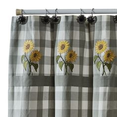 the sunflowers are embroidered onto the curtains