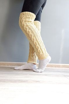 These beautiful hand-knitted wool leg warmers are made to keep your feet warm and healthy during cold winter days. You can wear them as home thick socks, as yoga socks, or put them on your mountain shoes. They are also made with a modern cable knit design and could be a perfect finish for your daily style. Material: 100% natural sheep wool yarn! Natural sheep colors.  One size: Length - 55 cm Width - 12 cm measured on flat. If you need different measurements, please let me know in a message.  Bu Cozy Knitted Footless Leg Warmers, Cozy Hand Knitted Fitted Leg Warmers, Handmade Fitted Cozy Socks, Cozy Knitted Beige Leg Warmers, Cozy Knitted Leg Warmers, Cozy Beige Knitted Leg Warmers, Comfortable Cable Knit Leg Warmers For Winter, Hand Knitted Cozy Leg Warmers, Cozy Thick Knitted Leg Warmers